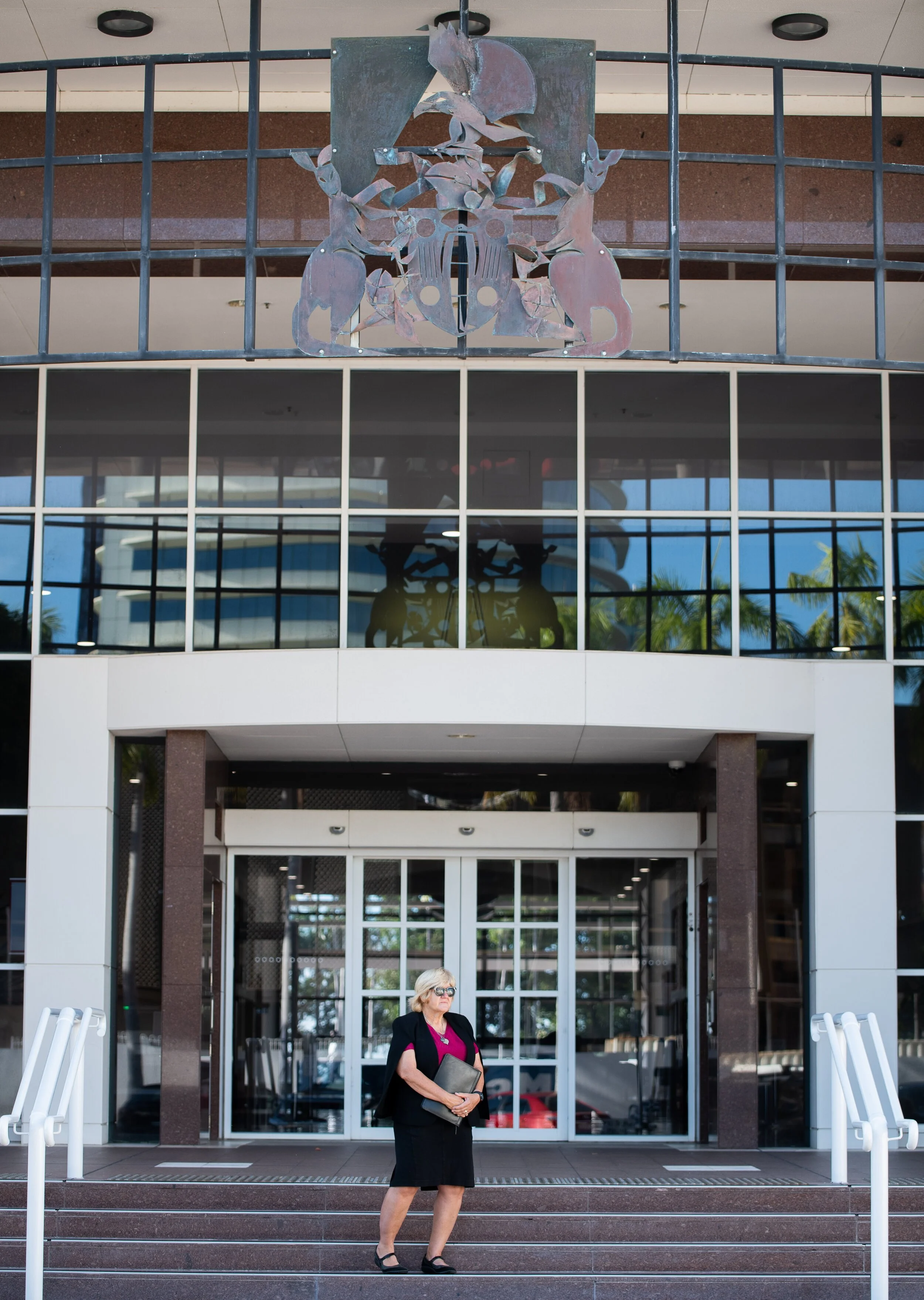 Jacqui Griffin standing on the steps outside a courthouse